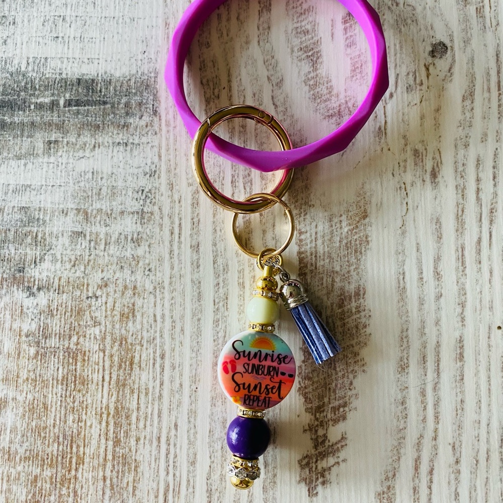 Vibrant Purple and Gold Keychain with Tassel